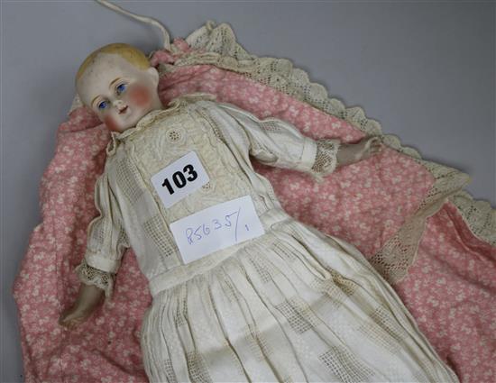 An 1860s English or German bisque head doll with hand painted eyes 36cm